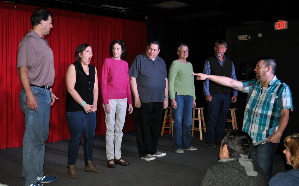 L - R: Robert, Whitney, Monica, Alan, Gail, Jon on tage, with host Cris pointing
