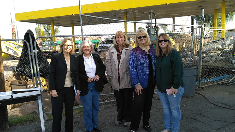 Legislative Reps. Kirsten Engel, Pamela Powers Hannley (far left) and Kelli Townsend (right) with ADEQ staff (center) and Senator Andrea Dalessandro-- watching gas tank removal on a chilly December morning.