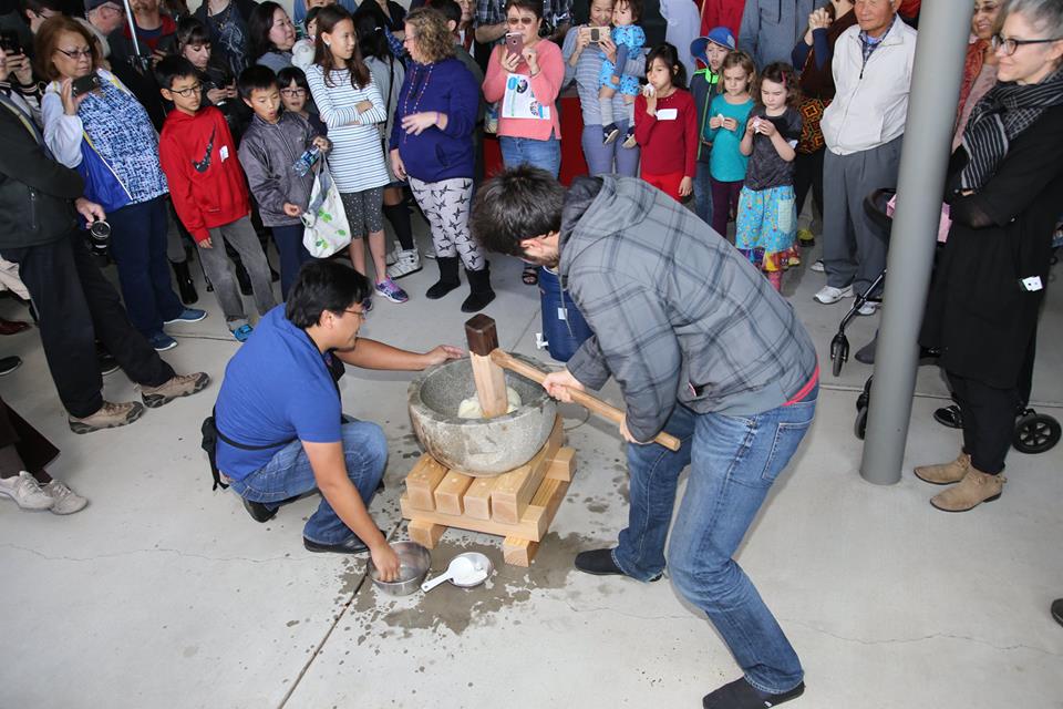 Mochi (rice) pounding in stone usu and wooden kine