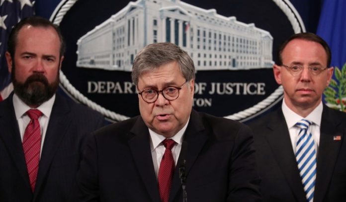 U.S. Attorney General Barr, flanked by Acting Principal Associate Deputy Attorney General O'Callaghan and Deputy Attorney General Rosenstein, speaks at a news conference on his release of the Mueller report in Washington