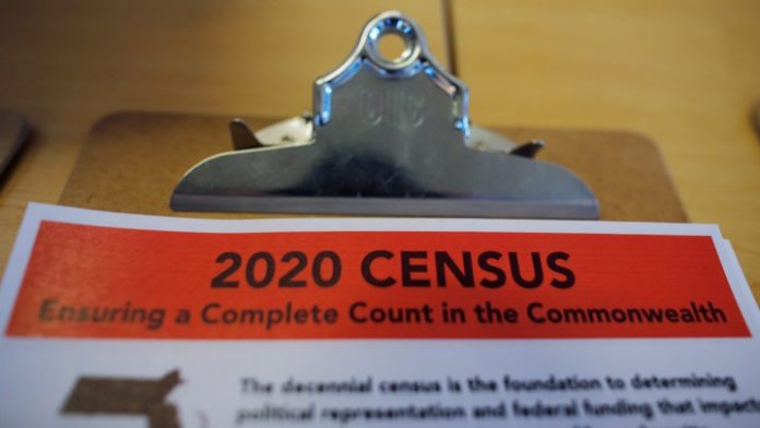 FILE PHOTO: An informational pamphlet is displayed at an event for community activists and local government leaders to mark the one-year-out launch of the 2020 Census efforts in Boston