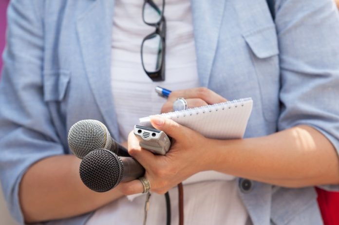 journalist taking notes