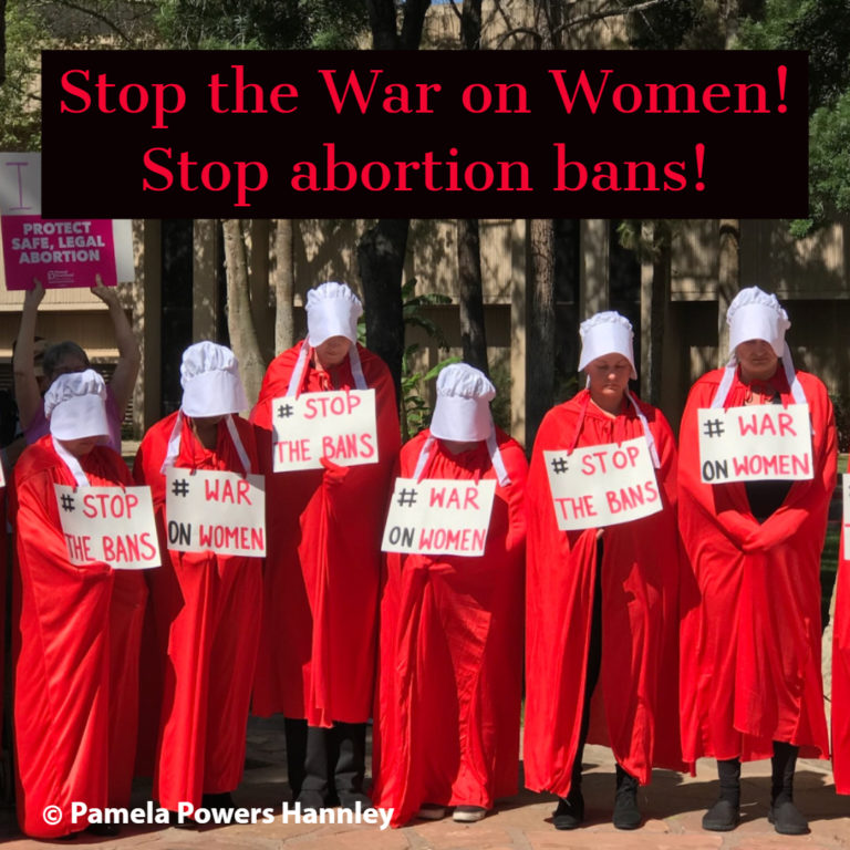 Handmaids protest abortion bans in Phoenix.