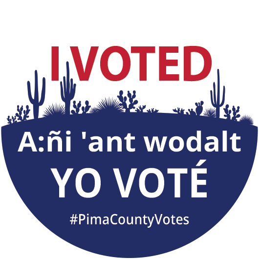 Pima County’s new early voting sticker, with a silhouette of cacti in dark blue. The sticker reads “I voted!” in English, “A:ñi ‘ant wodalt” in Tohono O’odham and “Yo Voté” in Spanish.