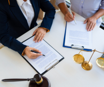 Stock photo of people editing and signing legislation
